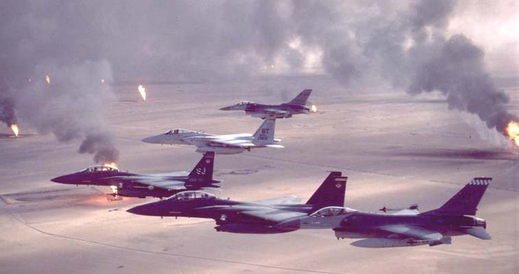 USAF aircraft (F-16, F-15C and F-15E) fly over Kuwaiti oil fires, set by the retreating Iraqi army during Operation Desert Storm in 1991