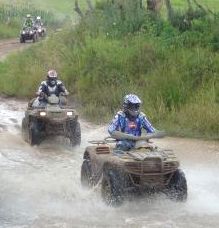 Quad bikes crossing river