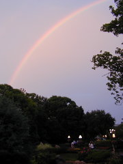 Refractive phenomena, such as this rainbow, are due to the slower speed of light in a medium (water, in this case).