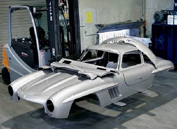 Replica car is taken to the crusher