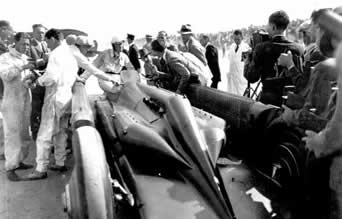 Henry Segrave stepping out of the cockpit of Golden Arrow at Daytona beach after breaking the record on a single practice run with an average speed of 231.44mph in March 1929.