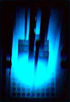 Cherenkov effect in a "swimming pool" nuclear reactor. The effect is due to electrons moving faster than the speed at which light moves in water.